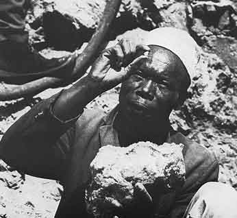 Miner Examining Tanzanite Crystal photo image